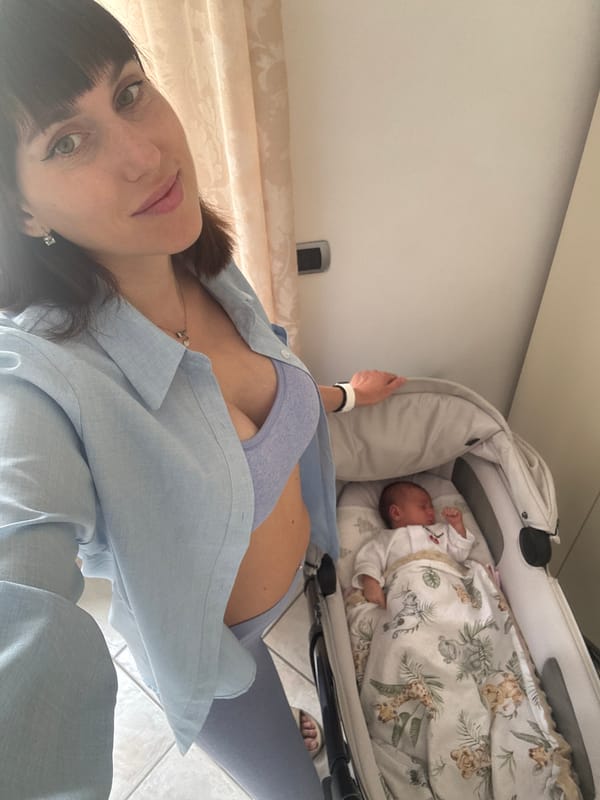 Mother documents morning moments with baby in Aprilia bedroom