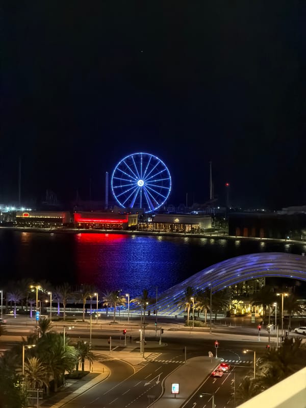 Nighttime scenes of illuminated Lusail waterfront captured from above