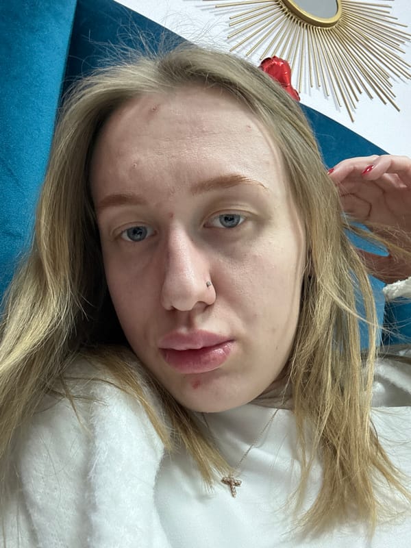 Woman photographed on blue couch in Rostov-on-Don apartment