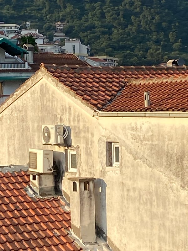 Aerial documentation of Budva cityscape during golden hour