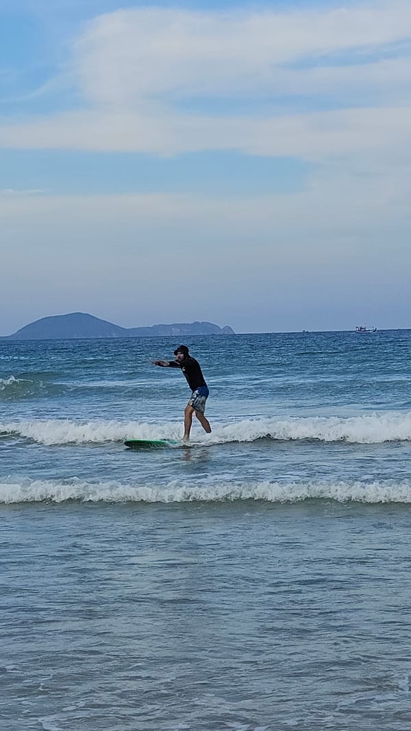 Surfer documents morning session at Bai Dai Beach, Vietnam