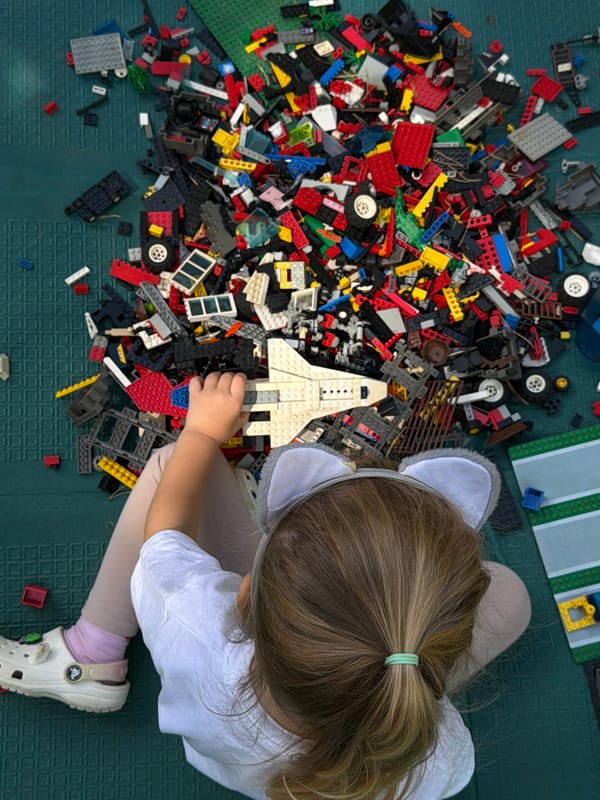 Summer morning play in a Russian backyard: LEGO, bubbles, and strawberries