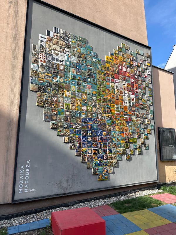 Street scenes documented in Wrocław including police building, mosaic