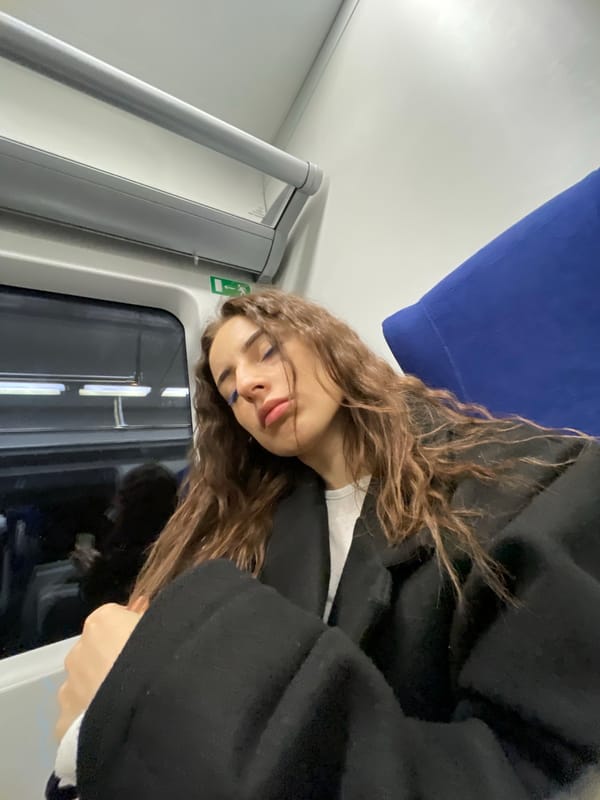 Women pose for selfies on Moscow public transport