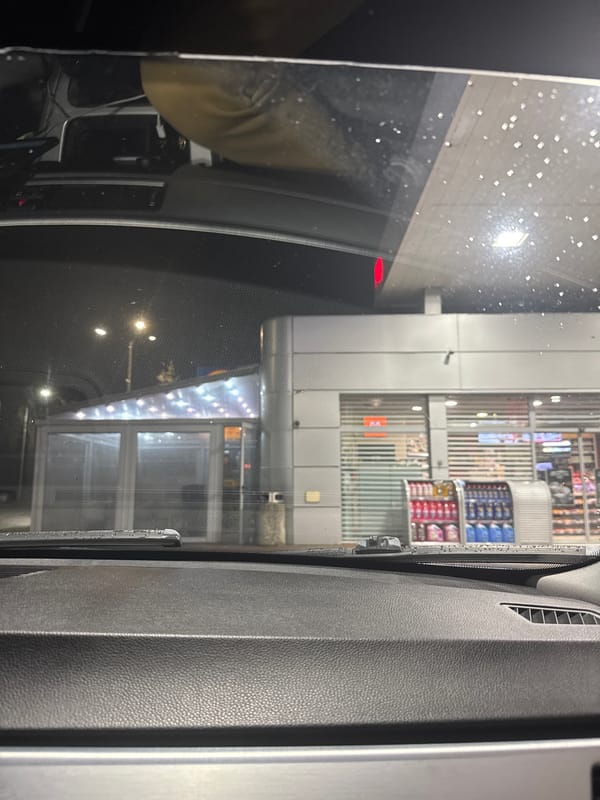 Rainy evening view of store from car in Velingrad