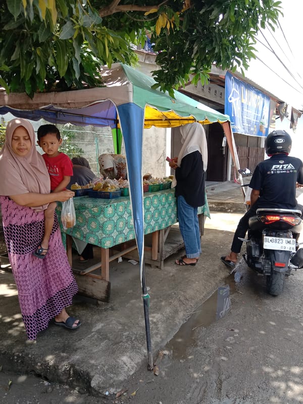 Daily life documented across Lhokseumawe streets and buildings