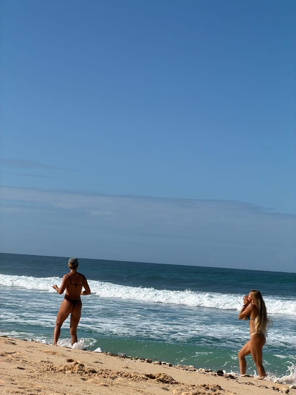 Two women enjoy beach time in Kuta Selatan