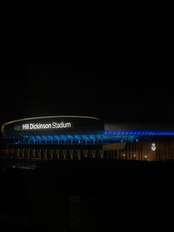 Hill Dickinson Stadium illuminated at night in Liverpool