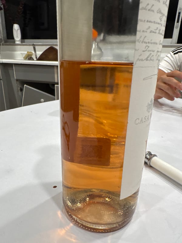 Rosé wine bottle photographed on white surface in Mexico City