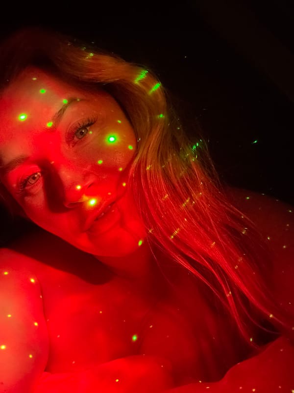 Portrait under red and green starry lights in Veliky Novgorod