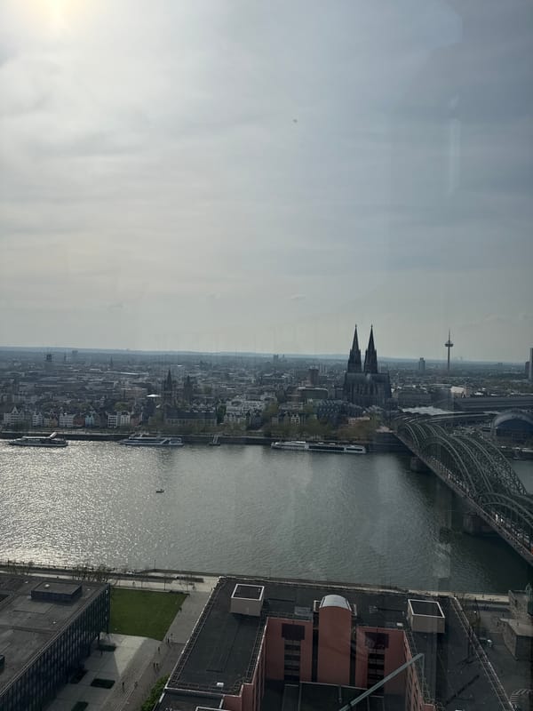 Aerial views document Cologne cityscape from elevated position