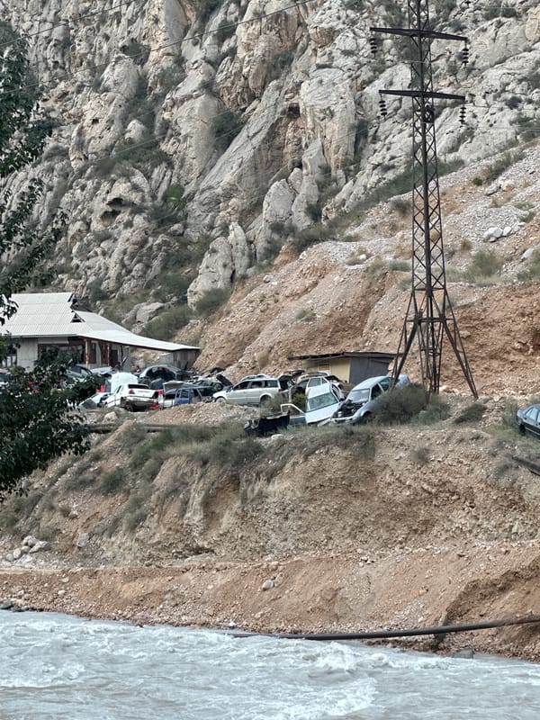 Passing through Кызыл-Булак, Kyrgyzstan, river town in the mountains