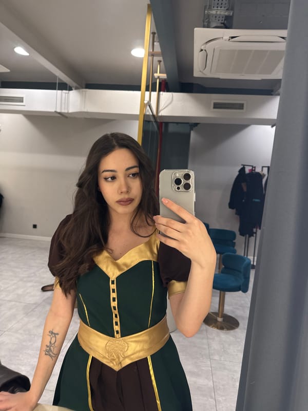Woman takes mirror selfie in Yerevan retail space