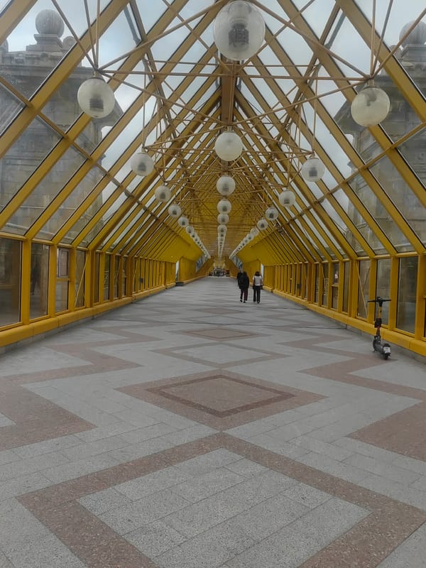 Moscow's yellow glass bridge and Moskva River on a grey afternoon