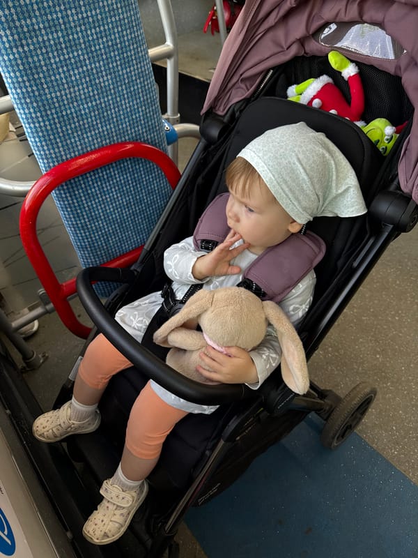 Child sleeps peacefully in stroller on Moscow street