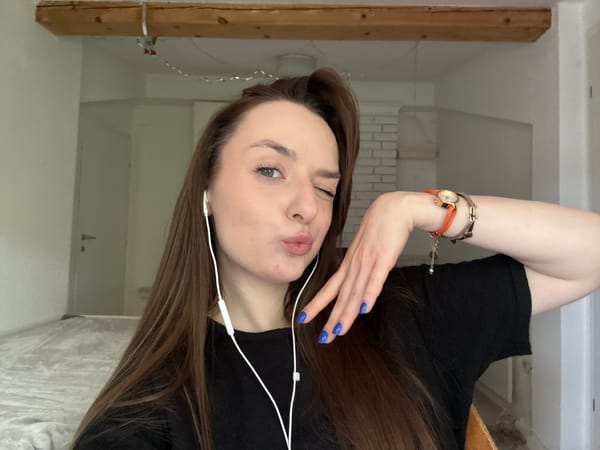 Woman conducts video call from Belgrade home workspace