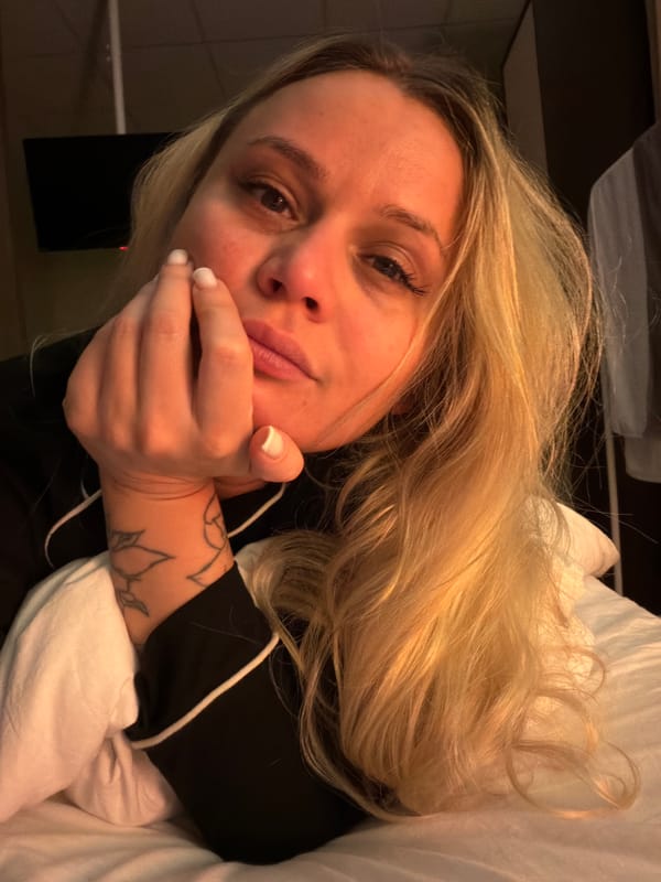 Woman takes multiple selfies indoors in Sarapul, Russia