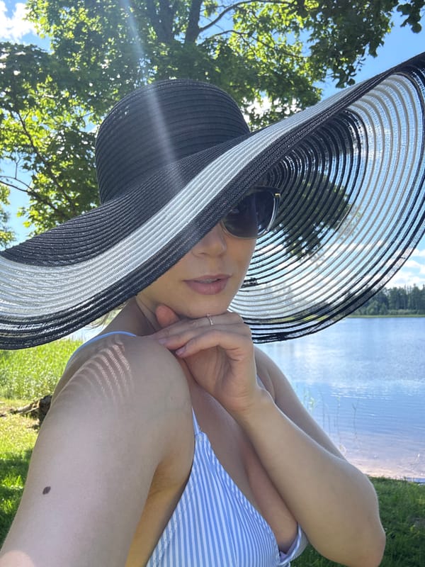 Summer day at a Latvian lake: paddleboarding, picnicking, fishing