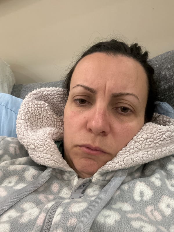 Woman rests in bed at home in Sofia