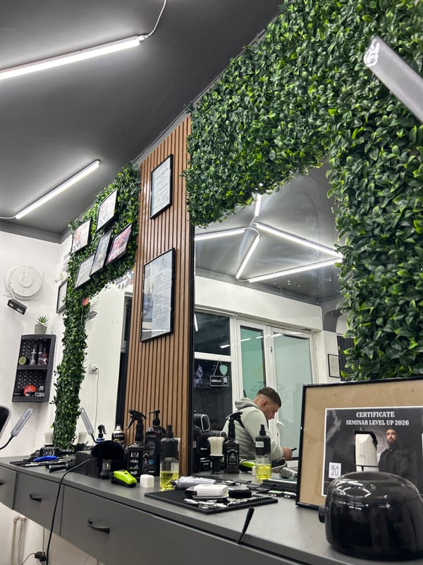 Men gather at barbershop in Buhovo, Bulgaria