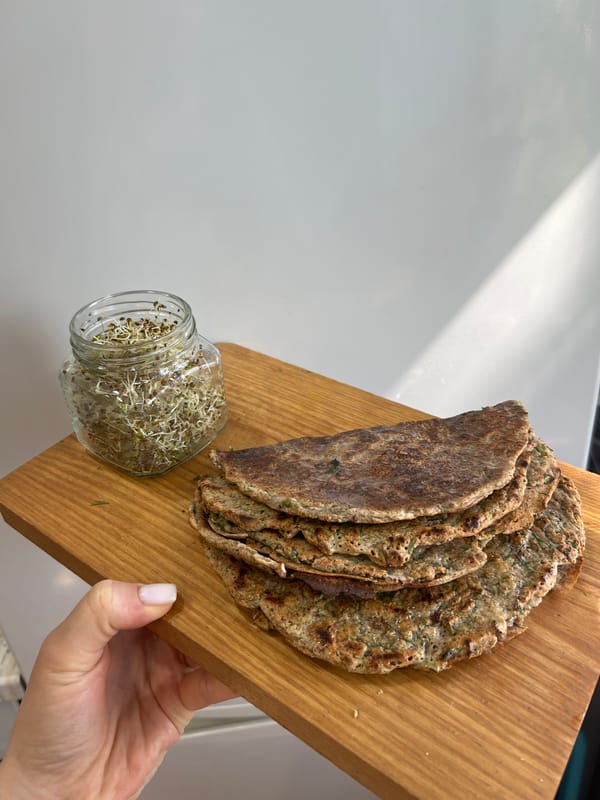 Morning kitchen session features green smoothie preparation with fresh herbs