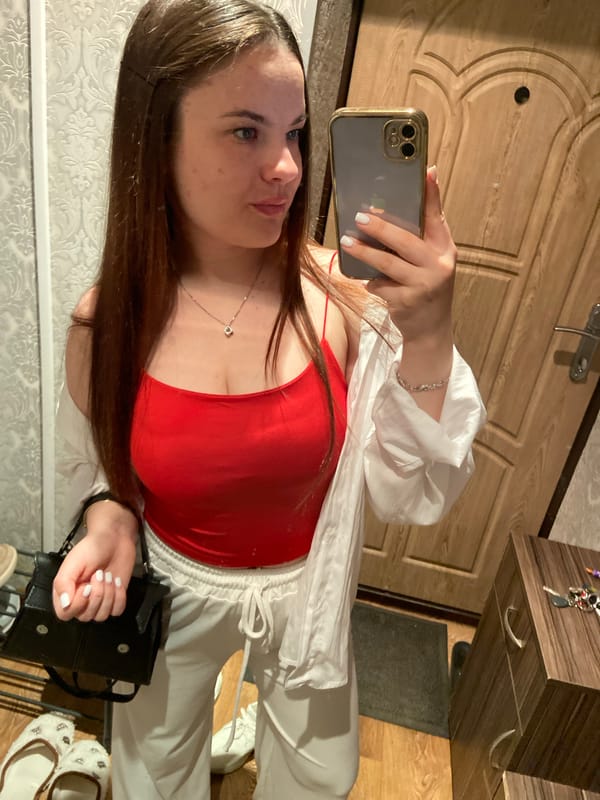 Mirror selfies and a drowsy Scottish Fold cat at home in Poltava