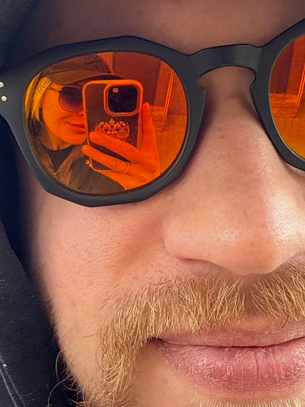 Person photographed wearing orange sunglasses in Borzya, Russia