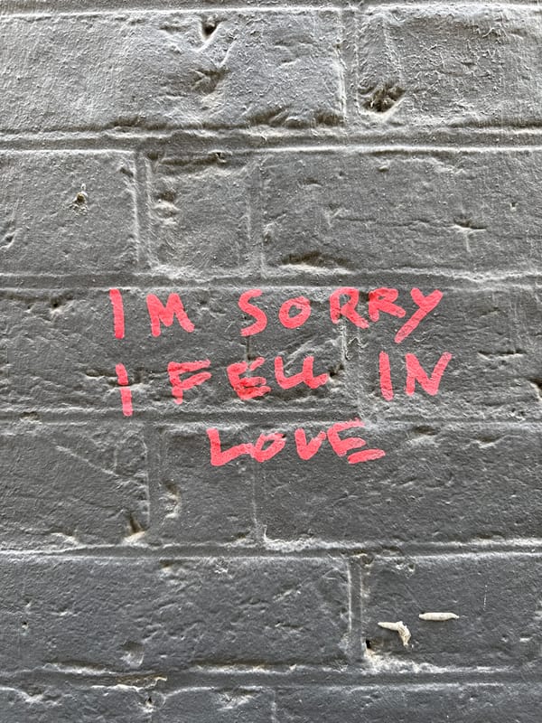 Love apology graffiti spotted on London brick wall