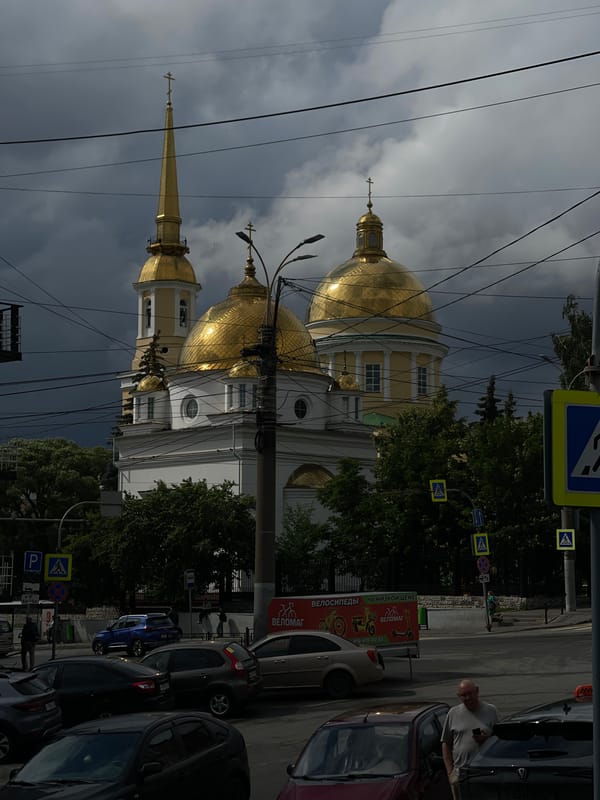 Inside a Russian bakery, golden domes visible outside