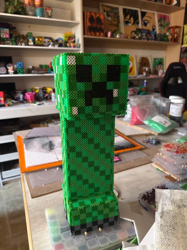 Handmade Minecraft Creeper craft displayed in Puebla