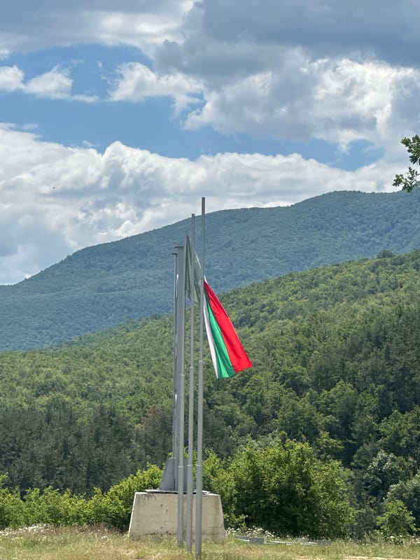 Bulgarian flag flies over mountain landscape in Patalenitsa