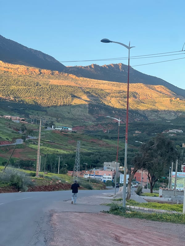 Daytime moon visible over Ouaouizert Morocco mountain landscape