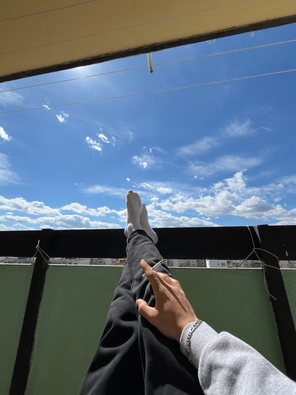 Young man spends morning on Bulgarian balcony smoking, taking selfies