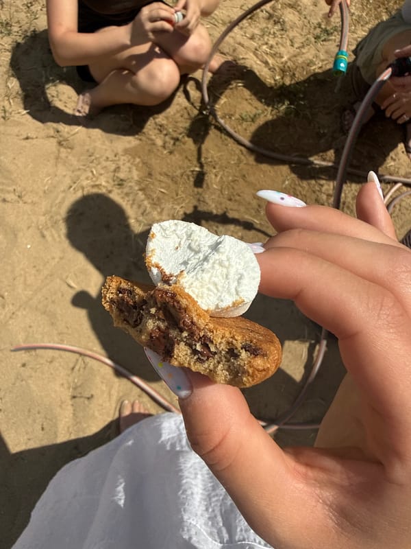 Person enjoys decorated desserts in Bulgarian coastal town
