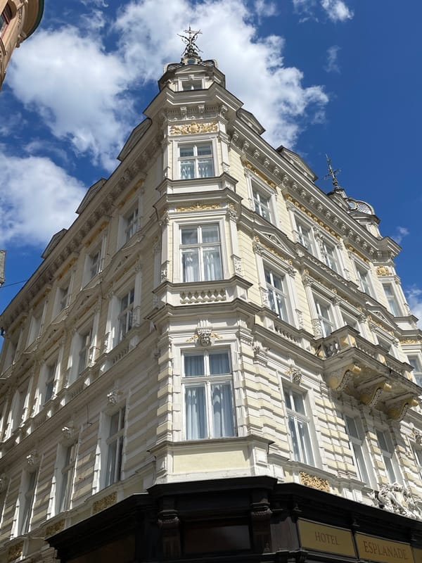 Walking a European city's ornate streets on a summer morning