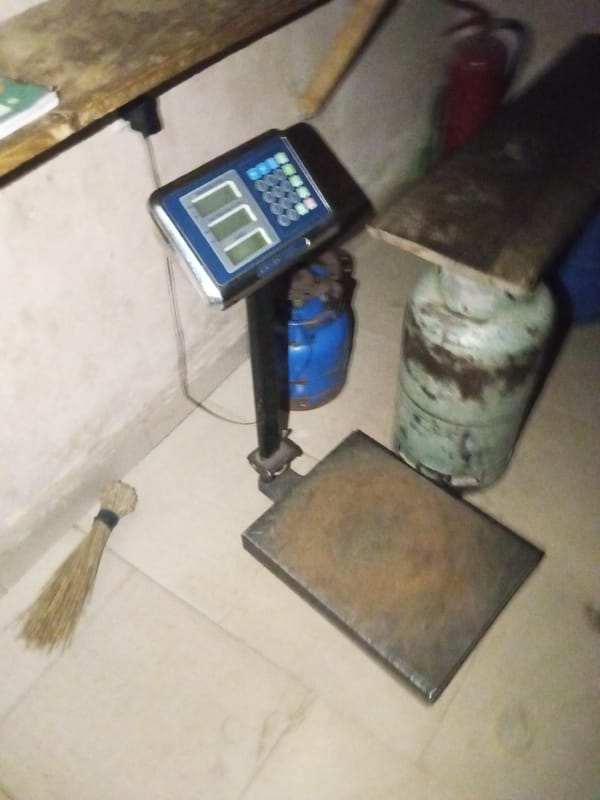 Inside a cramped storage room stocked with gas and supplies