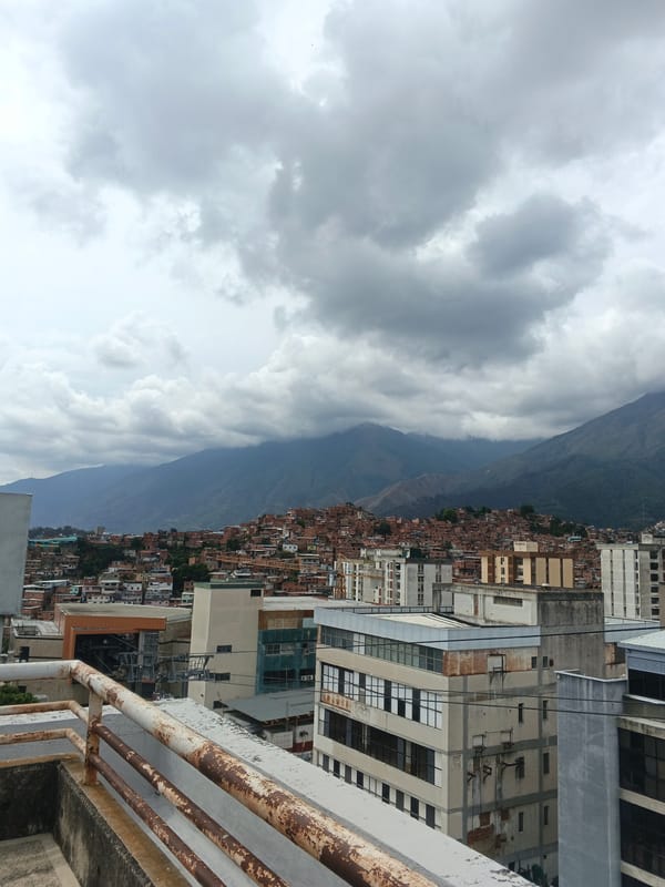 Cloudy skies blanket Caracas cityscape in aerial view
