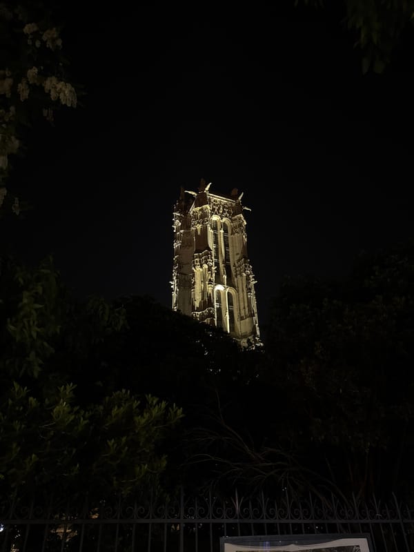 Paris landmarks Tour Saint-Jacques and Notre Dame illuminated at night