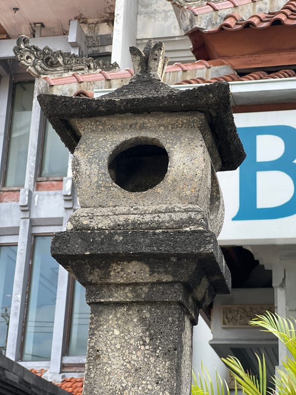 Kuta street details: statues, palms, and everyday scenes