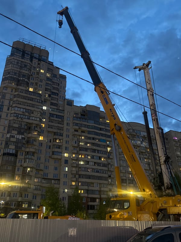 Person documents evening walking tour through Saint Petersburg streets