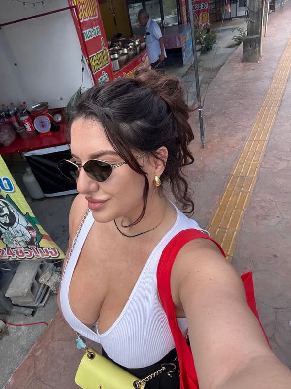 Tourist visits street food stall in Patong, Thailand