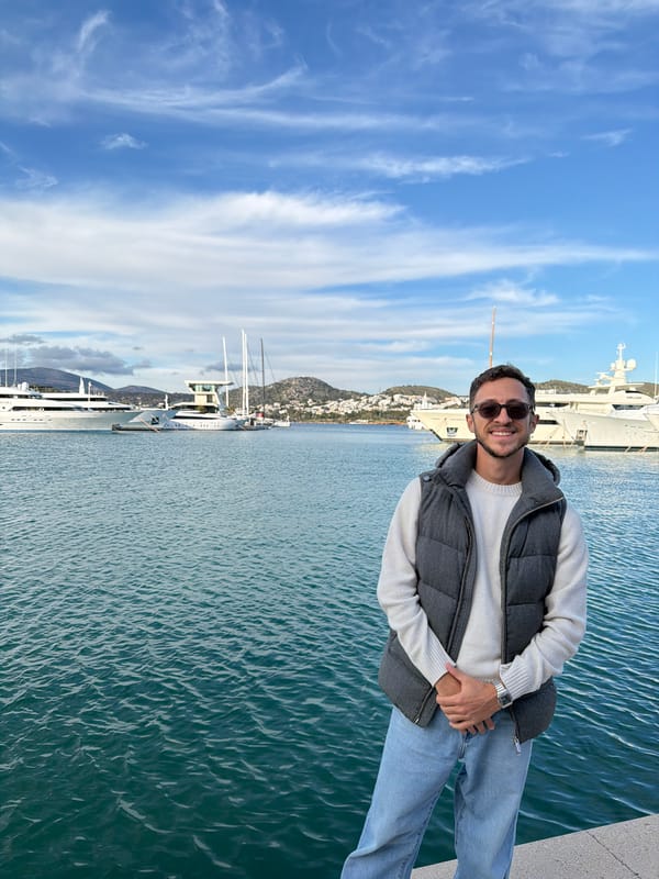 Leisure day at Vouliagmeni marina with yachts and tourists