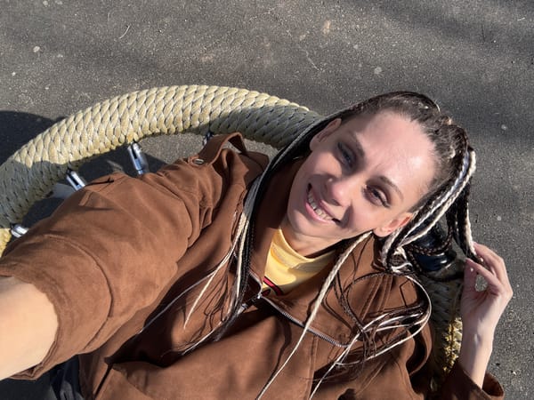 Woman enjoys rope swing on sunny morning in Zhukovo