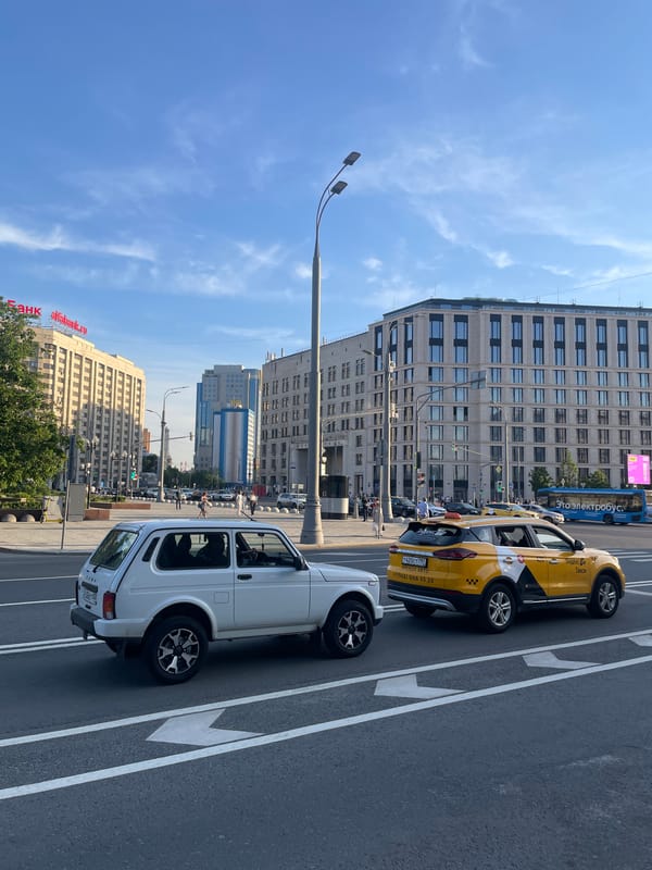 Moscow street scenes show parked cars and church architecture