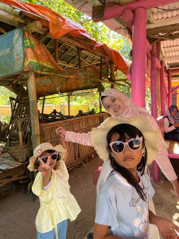 Women gather for photos at Indonesian outdoor market