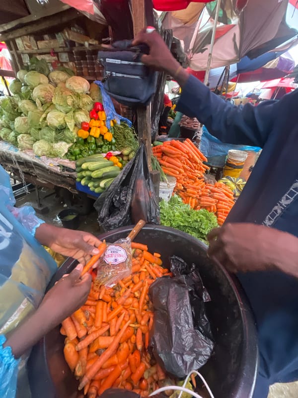 Daily marketplace life documented across Ado Nigeria during rainy morning