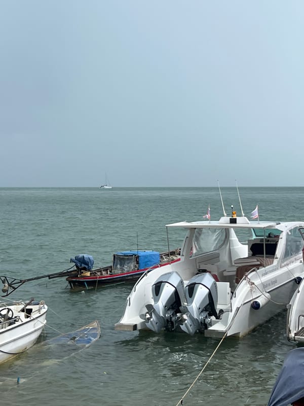 Busy morning at a Pa Khlok pier, boats and jet skis everywhere