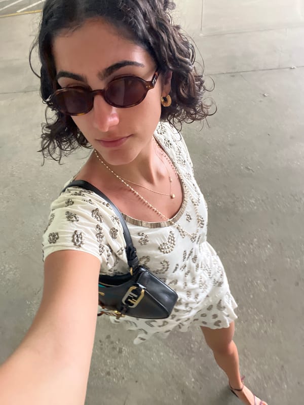 Woman in white dress spotted on Miami concrete surface