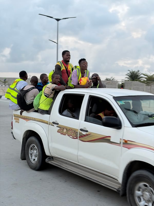 Workers transported by truck under stormy skies in Alaguntan