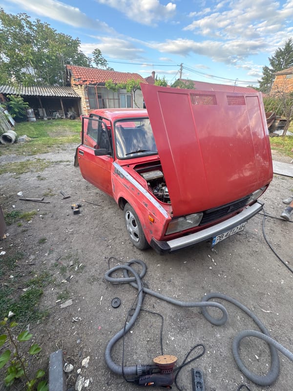 Red Lada undergoes repairs in Bulgarian village garage